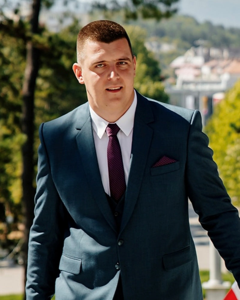 A person from Montenegro in a suit