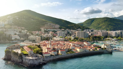 panoramic sunset aerial drone view of the ancient bay-of-montenegro-budva-old-town