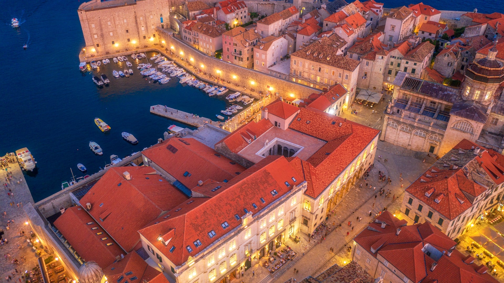 aerial-view-of-houses-with-red-roofs-at-night-in-dubrovnik